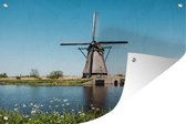 Tuindecoratie Molen - Bloemen - Water - Nederland - 60x40 cm - Tuinposter - Tuindoek - Buitenposter