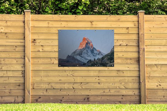 Tuinposter 120x80 cm - Tuindecoratie De Matterhorn in Zwitserland bij zonsopkomst - Poster voor in de tuin - Buiten decoratie - Schutting tuinschilderij - Tuindoek muurdecoratie - Wanddecoratie balkondoek