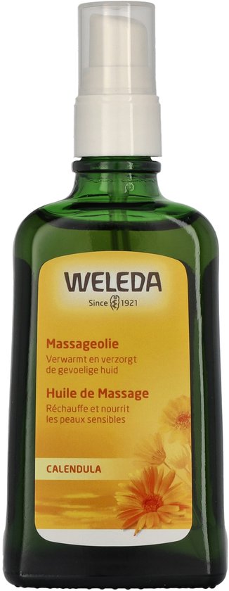 Groene glazen fles met Weleda massageolie. Op het gele etiket staat 'Massageolie' en 'Calendula'.