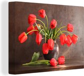 Canvas Schilderij Een boeket van rode tulpen tegen een donkere achtergrond - 80x60 cm - Wanddecoratie