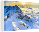 Canvas Schilderij Alpen - Berg - Wolken - Zon - 120x80 cm - Wanddecoratie