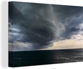 Canvas Schilderij Wolkenformatie over zee - 90x60 cm - Wanddecoratie