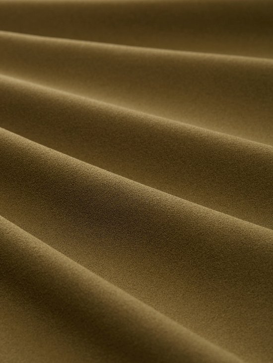 Golvende olijfgroene stof, close-up.