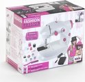 Verpakking van de witte en roze 'Fashion Passion' kindernaaimachine met afbeeldingen van accessoires en kinderen.