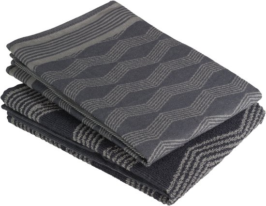 Torchons gris empilés avec motif graphique en zigzag et rayures.