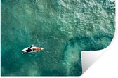 Muurstickers - Sticker Folie - Surfer die peddelt - 120x80 cm - Plakfolie - Muurstickers Kinderkamer - Zelfklevend Behang - Zelfklevend behangpapier - Stickerfolie