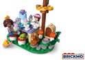 LEGO Friends speelset met twee poppen, een eekhoorn, kikker, en een tafel met cupcakes.