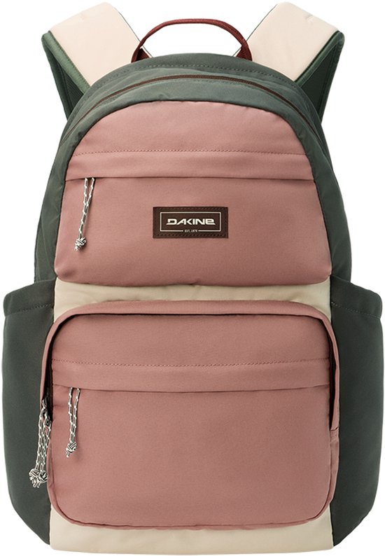 Dakine rugzak in roze, beige en olijfgroene vlakken, met twee ritsvakken aan de voorkant.