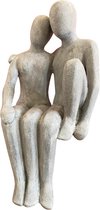 sculptuur man-vrouw zittend hoog 55 cm zandsteen grijs decoratief