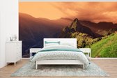 Behang - Fotobehang Zonsondergang Machu Picchu in Peru - Breedte 500 cm x hoogte 280 cm