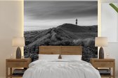 Behang - Fotobehang Waddenzee - Zwart - Wit - Vuurtoren - Breedte 350 cm x hoogte 350 cm