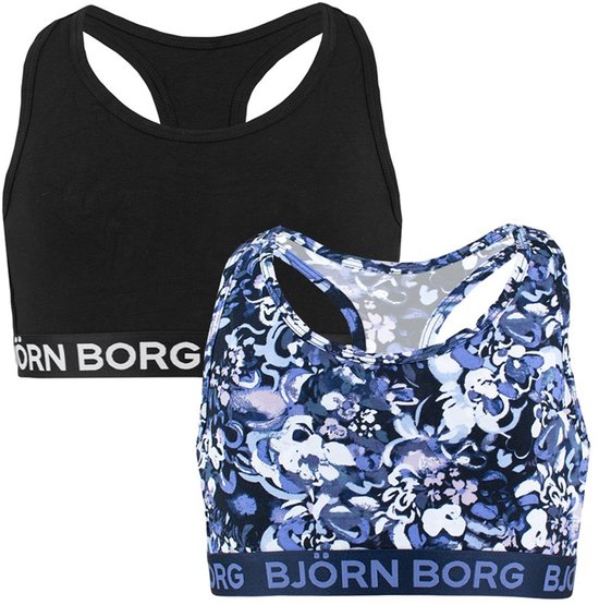 Twee sportbeha's: één zwarte en één met een blauw-paarse bloemenprint. Beide met Björn Borg logo.