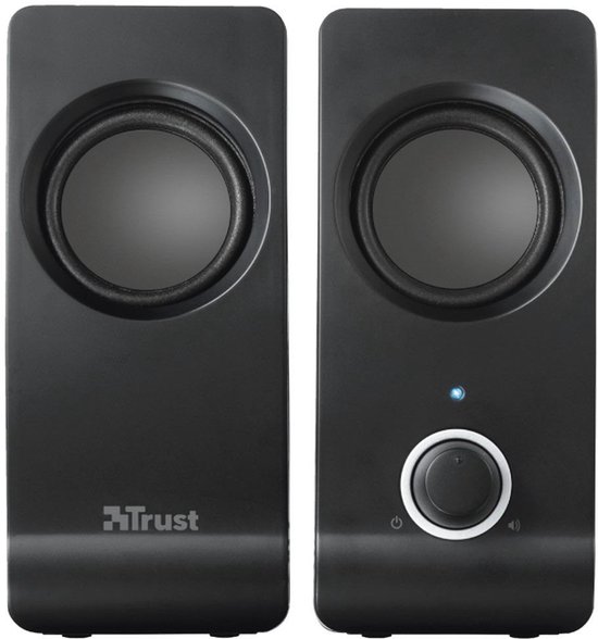 Twee zwarte Trust speakers met ronde speakers en een volumeknop op de rechter speaker.