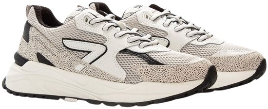 Dames sneaker in wit, grijs en zwart met stipjespatroon en sportieve zool.
