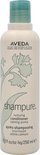 AVEDA Shampure Nurturing Conditioner fles met groene dop en bloemendessin.