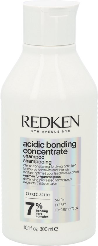 Bouteille blanche de shampooing Redken Acidic Bonding Concentrate avec une étiquette irisée.