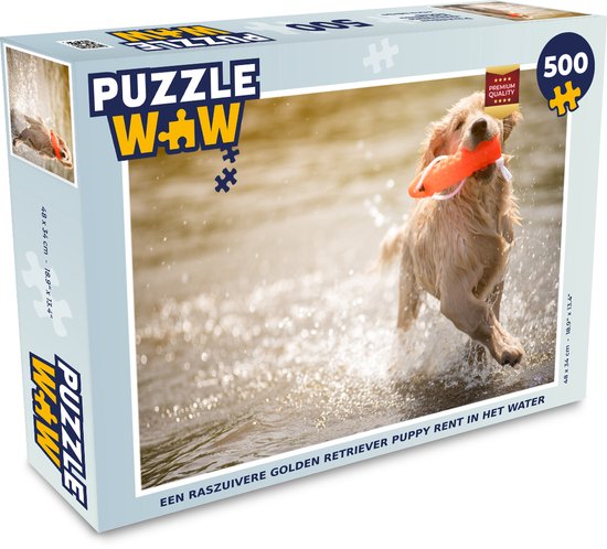 La boîte d'un puzzle de 500 pièces montrant un chiot Golden Retriever courant dans l'eau.