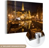 MuchoWow® Glasschilderij 120x80 cm - Schilderij acrylglas - Groningen - Nacht - Lichten - Foto op glas - Schilderijen