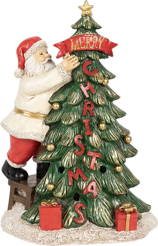 Père Noël décore un sapin avec le texte 'MERRY CHRISTMAS'.