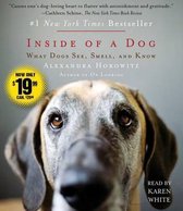 Boekcover van 'Inside of a Dog' met een close-up van een hondengezicht.