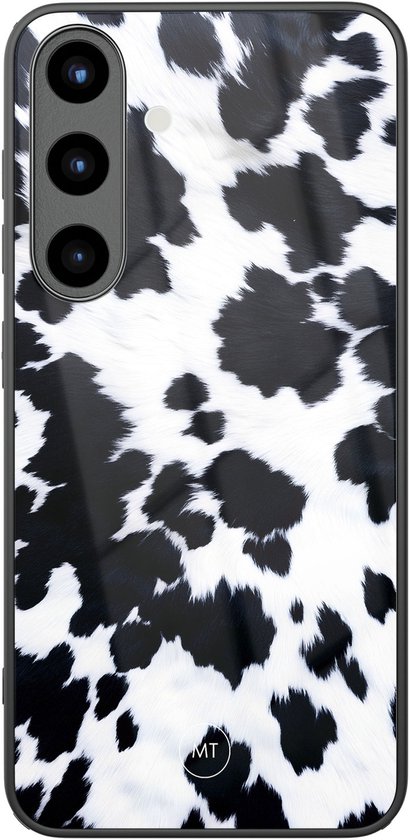 Coque de téléphone motif vache noir et blanc avec bordure noire et objectif de caméra.