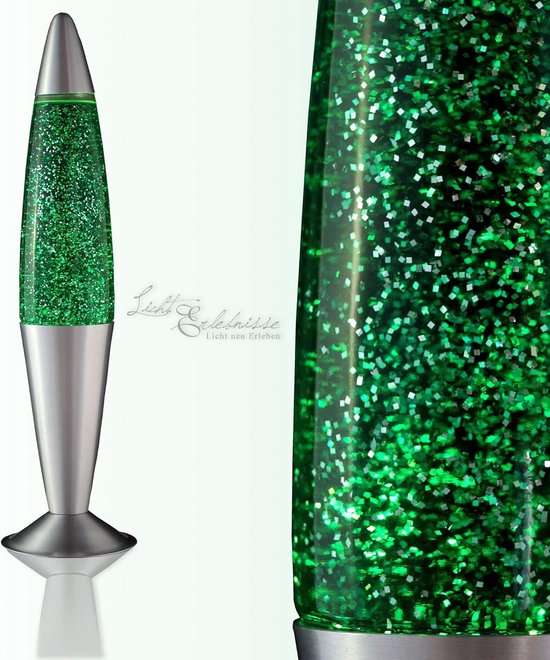 Glazen lavalamp met groene glitter en een zilveren voet en dop.