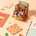 DIY miniatuur boekenwinkel model met boeken, een slapende kat en een lamp. Inclusief onderdelen.