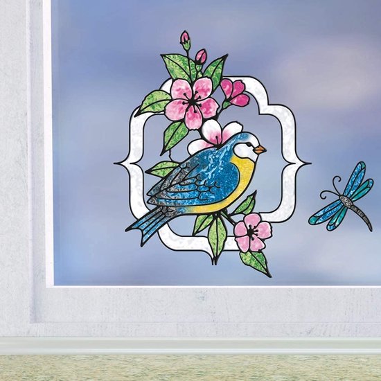 Een blauw-gele pimpelmees op een tak met roze bloemen in een sierlijk kader, met een libelle ernaast.