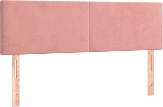 Tête de lit en velours rose, composée de deux panneaux, avec pieds en bois.
