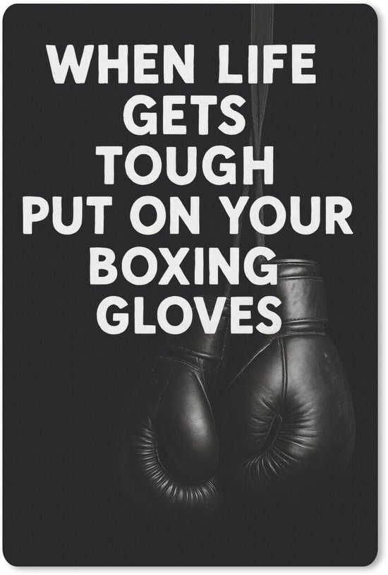 Zwarte bokshandschoenen hangen aan een touw met de tekst "WHEN LIFE GETS TOUGH PUT ON YOUR BOXING GLOVES" in witte letters.