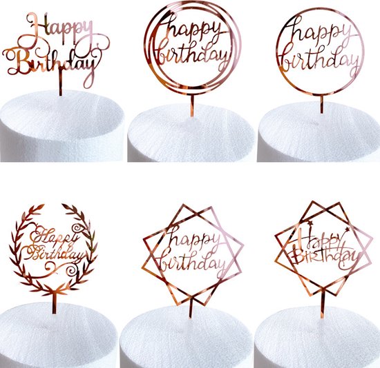 Zes rose gouden 'Happy Birthday' taarttoppers in verschillende lettertypen en ontwerpen.