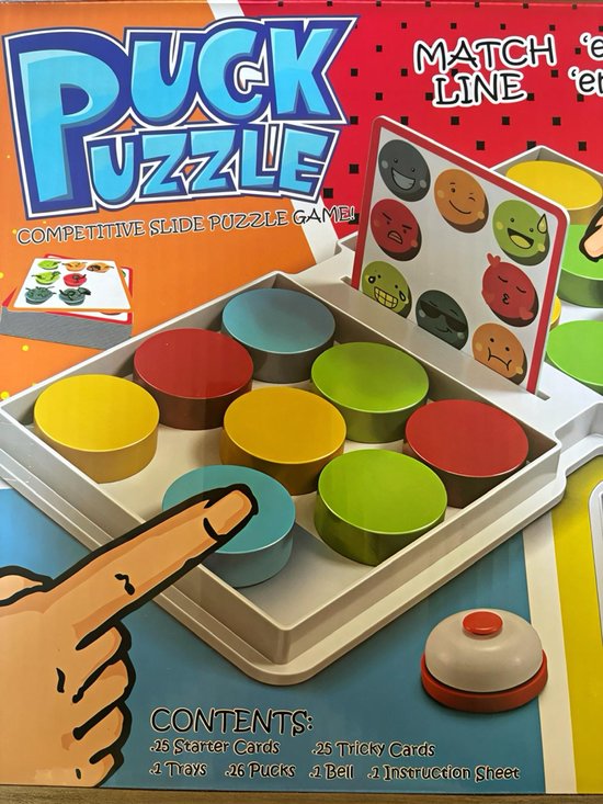 Puck Puzzel spel met kleurrijke pucks en spelinstructies op de doos.