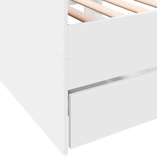 Gedetailleerde foto van de witte slaapbank met een uitgeschoven lade en houten lattenbodem.