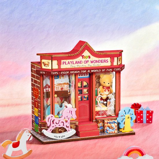 Miniatuur speelgoedwinkel 'Playland of Wonders' met rode gevel, stenen print, een roze hobbelpaard en speelgoed displays.