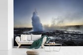 Behang - Fotobehang Een mistig beeld van de Geysir in IJsland - Breedte 360 cm x hoogte 240 cm