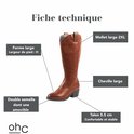 Gedetailleerde afbeelding van bruine laarzen met labels voor brede kuit, brede enkel, verwijderbare zool en hakhoogte.