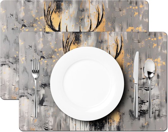 Deux sets de table avec un cerf abstrait, des éclaboussures dorées et des bois.