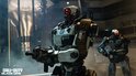 Twee robots met rode ogen en wapens in een industriële omgeving, met 'GUILD' logo op hun borst.
