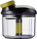 Tefal hakmolen met transparante container, zwarte deksel en limegroen handvat. De snij-as is zichtbaar in het midden.
