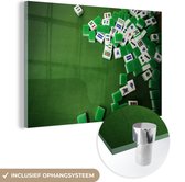 MuchoWow® Glasschilderij 60x40 cm - Schilderij acrylglas - Verschillende mahjong tegels tegen een groene achtergrond - Foto op glas - Schilderijen