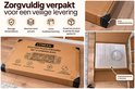 De doos van het puzzelbord met hoekbescherming, schuim en instructies voor een veilige verzending.
