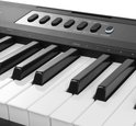 Knopjes en zwarte toetsen van een MAX keyboard, met labels als 'REC/STOP' en 'POWER'.