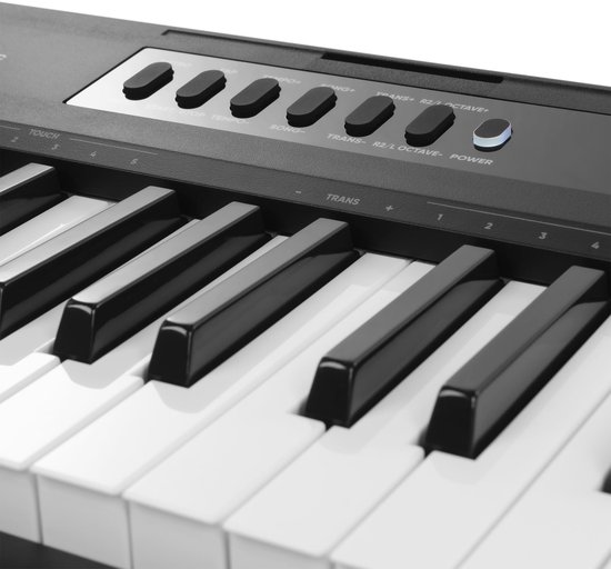 Knopjes en zwarte toetsen van een MAX keyboard, met labels als 'REC/STOP' en 'POWER'.