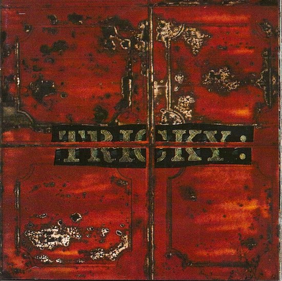Rode albumhoes met roestige metalen textuur en het woord TRICKY in een zwarte balk.