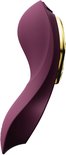 Vibrateur violet avec détail doré sur le côté.