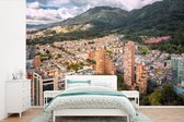 Behang - Fotobehang Luchtfoto van Bogota in Colombia - Breedte 600 cm x hoogte 400 cm