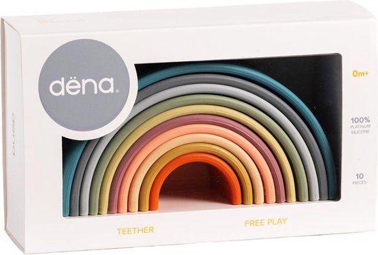 Dëna siliconen speelgoed regenboog in de verpakking. '0m+' en '10 PIECES' op de doos.