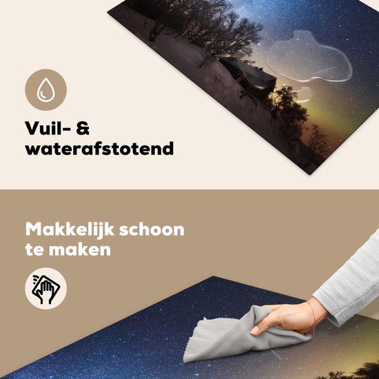 KitchenYeah® Inductie beschermer 81.6x52.7 cm - Sterrenhemel - Landschap - Zweden - Sneeuw - Winter - Kookplaataccessoires - Afdekplaat voor kookplaat - Inductiebeschermer - Inductiemat - Inductieplaat mat