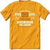 99 Jaar Legend T-Shirt | Goud - Wit | Grappig Verjaardag en Feest Cadeau Shirt | Dames - Heren - Unisex | Tshirt Kleding Kado | - Geel - M
