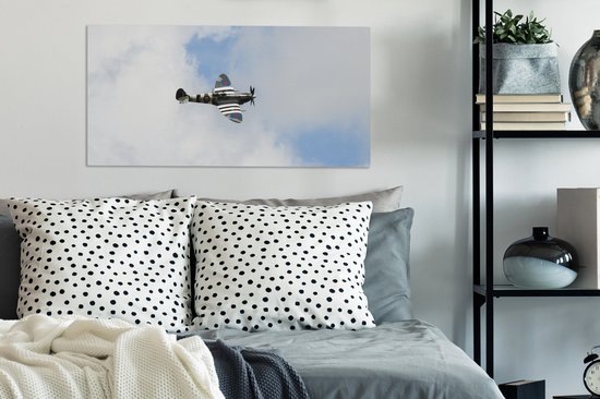 Tableau sur toile Avion Spitfire dans un ciel nuageux - 80x40 cm - Décoration murale